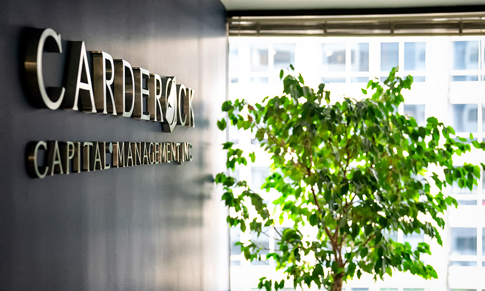 Carderock Capital Logo in office lobby wall with window view